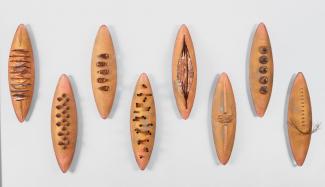 Seven oval glass sculpture in bronze.