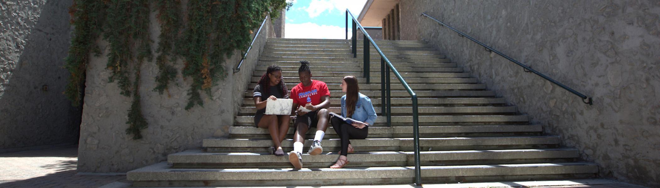 students sitting on stairs