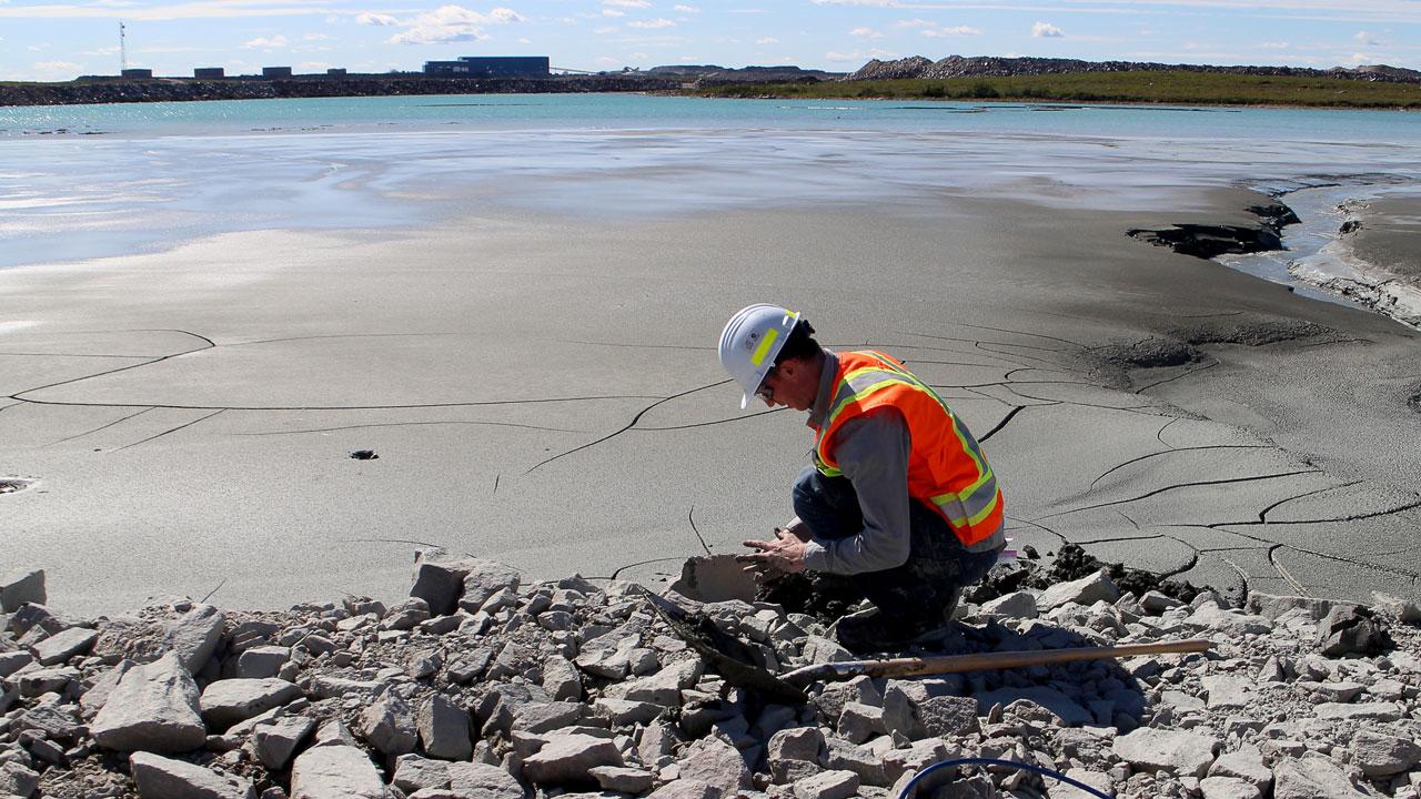"Trent University assistant professor Dr. Ian Power collects mine tailings from the De Beers’ Gahcho Kué Diamond Mine in the Northwest Territories."