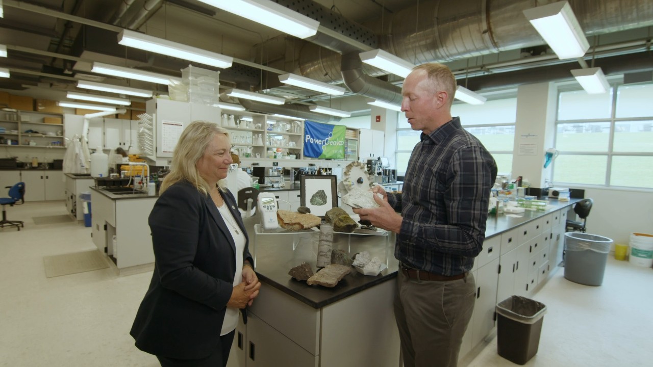 Ian Power and Cathy Bruce in a science lab
