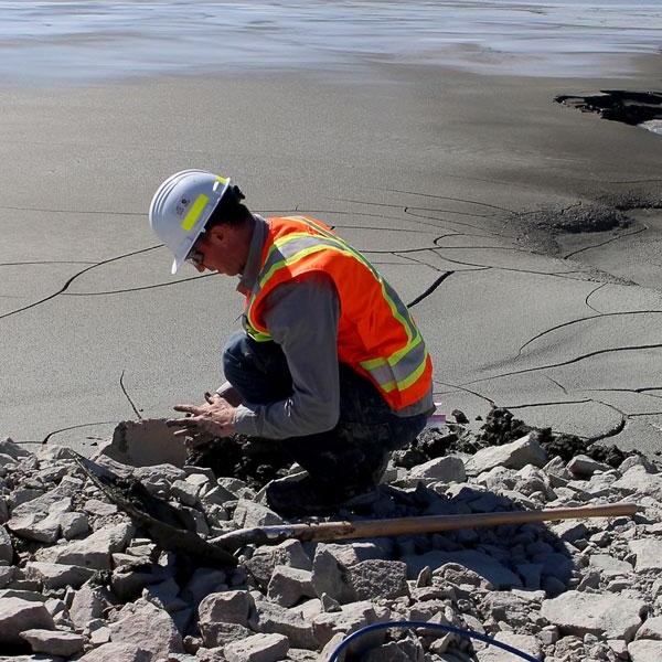 Ian Power collecting samples at a mine