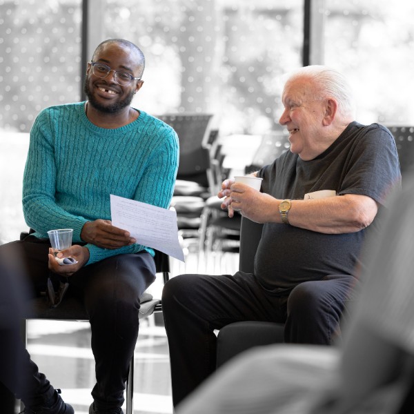 A student working with an older adult