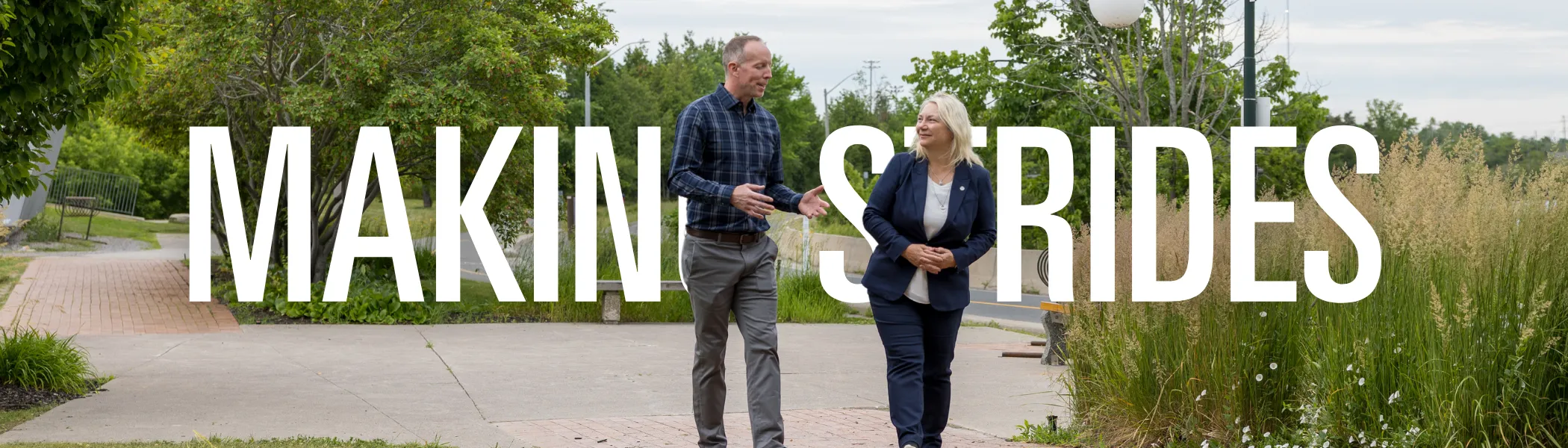 Dr. Cathy Bruce walking with Dr. Ian Power