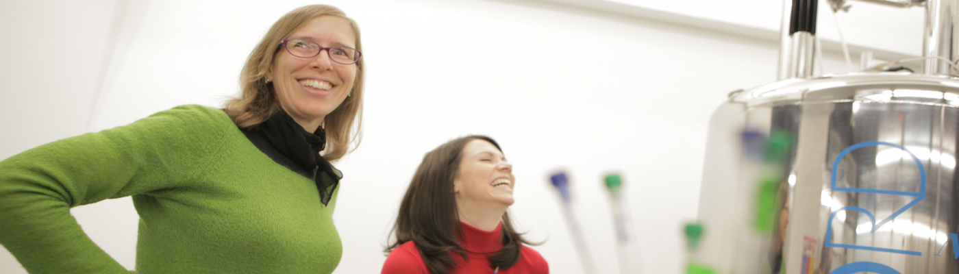 professor wortis and female student laughing in lab
