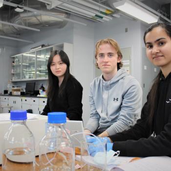 photo of three students in lab