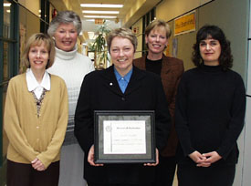 Susan Mackle accepting an award
