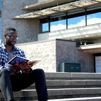 Trent Student studying at Bata Library steps 