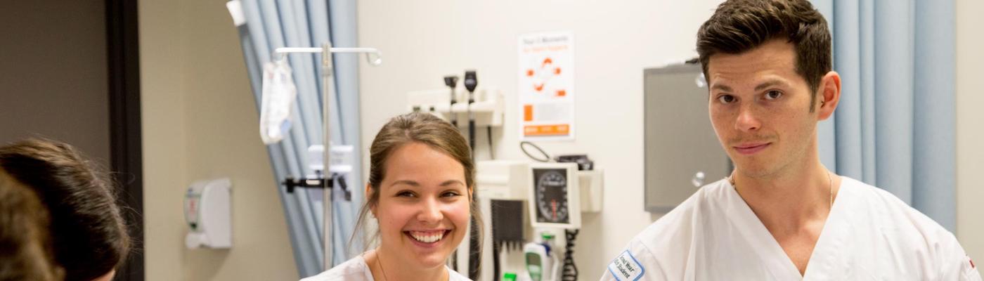 Two nursing students in TFSON scrubs