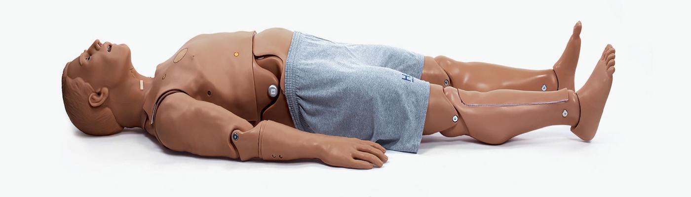 Hal, a high fidelity simulation manikin pictured lying down, face up.