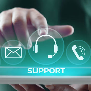 Icons representing various ways to get in touch with support services illuminated over an ipad.