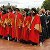 Convocating students standing on the podium in their gowns: June 5, 2014 - Morning