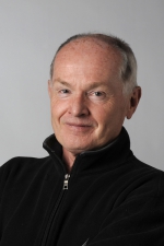 Head and shoulders photo of Roy MacGregor smiling ath the camera