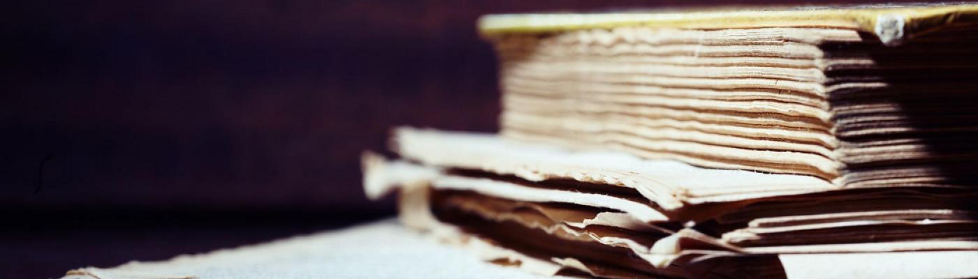 Closeup view of a stack of manuscripts on a desk