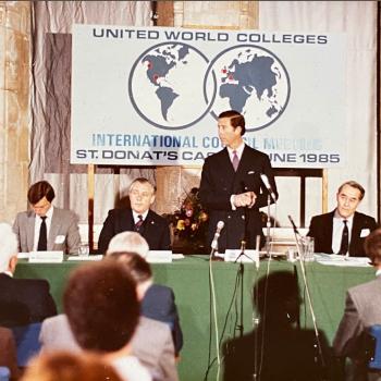 THB Symons presenting in front of a crowd.