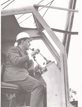 Tom B.H. Symons at the controls of excavator