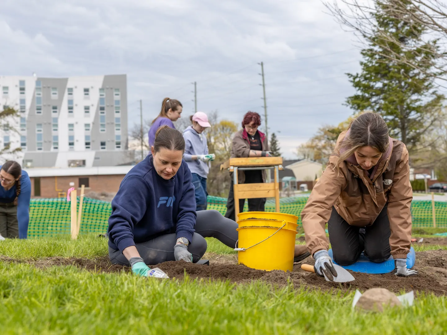 Trent Durham students doing a archaeological dig.
