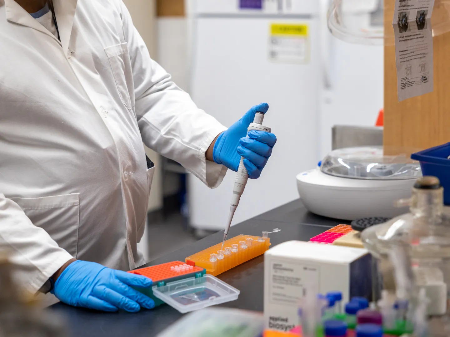 Student using pipette to conduct research