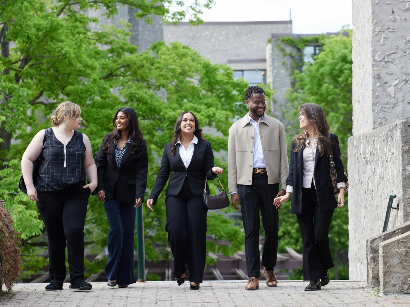 Students walking outside talking.