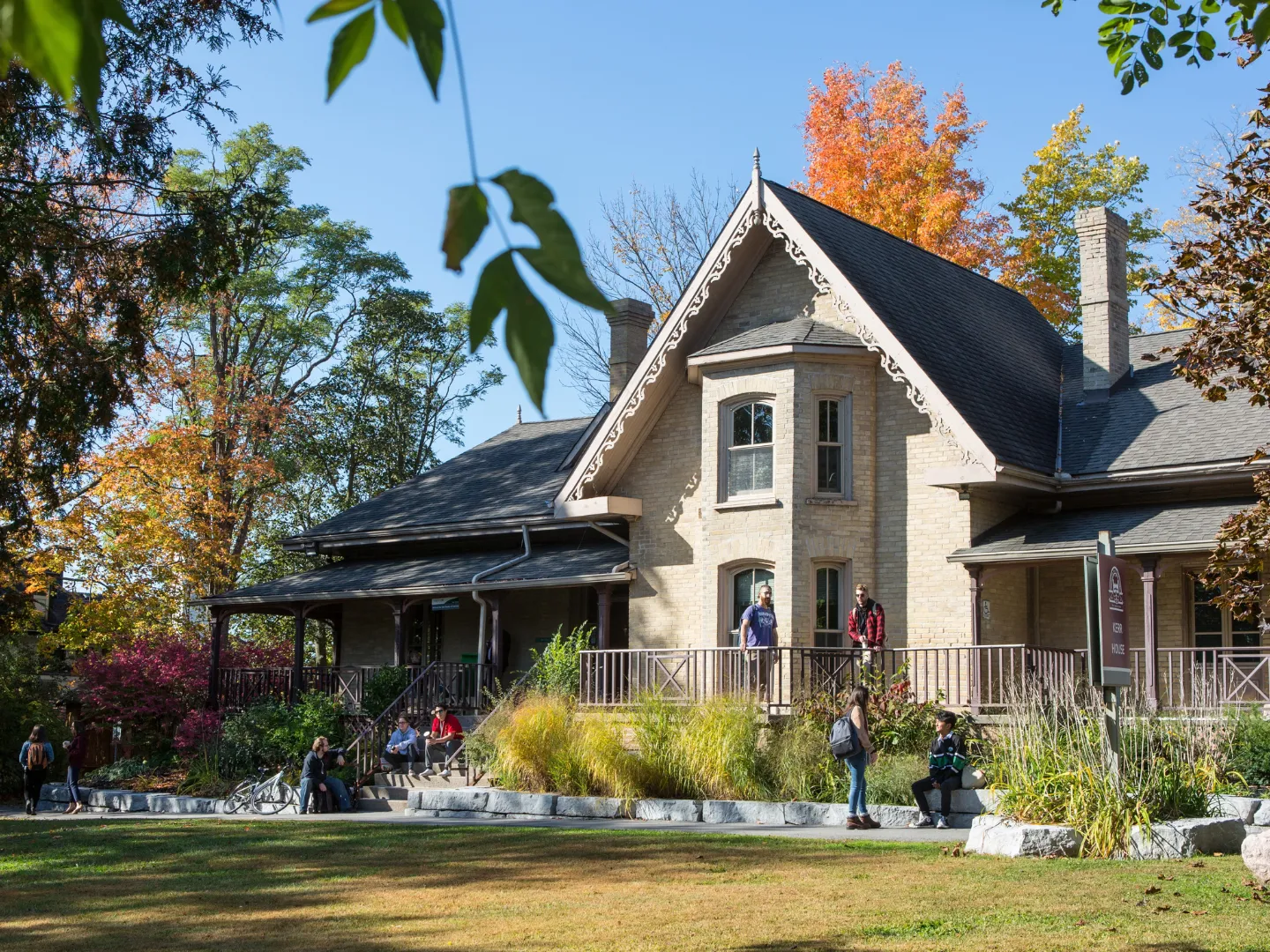 People outside of Kerr House, Traill College.