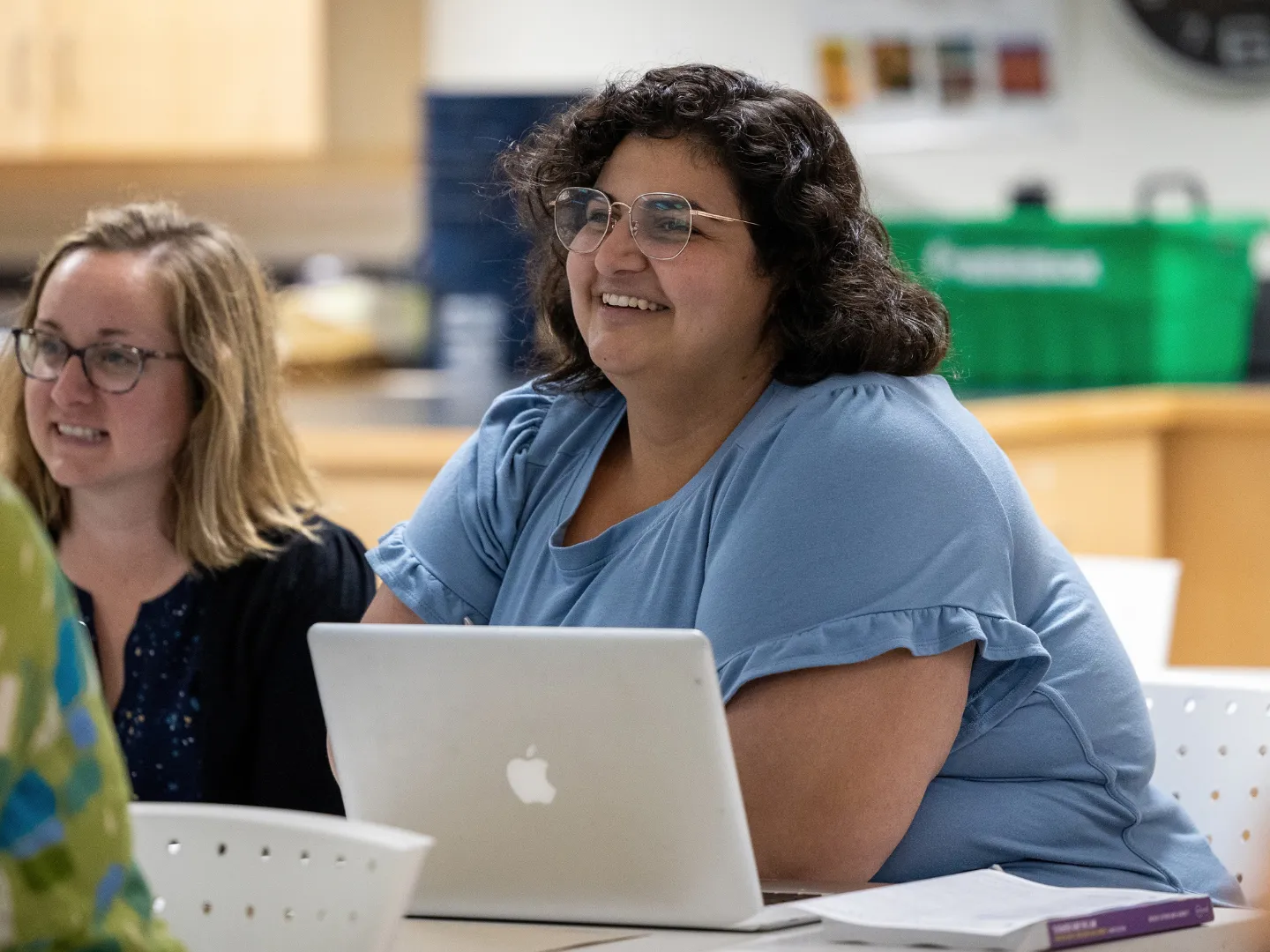 Educational studies students in seminar with computer.