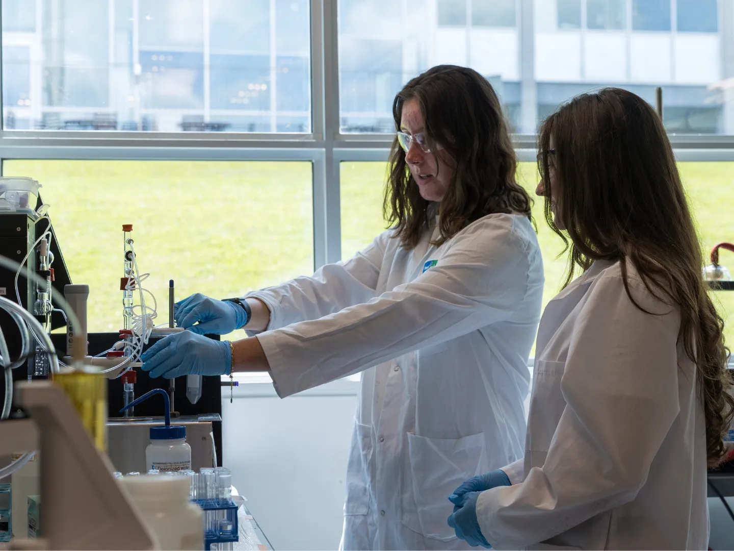 Two students working in a lab.