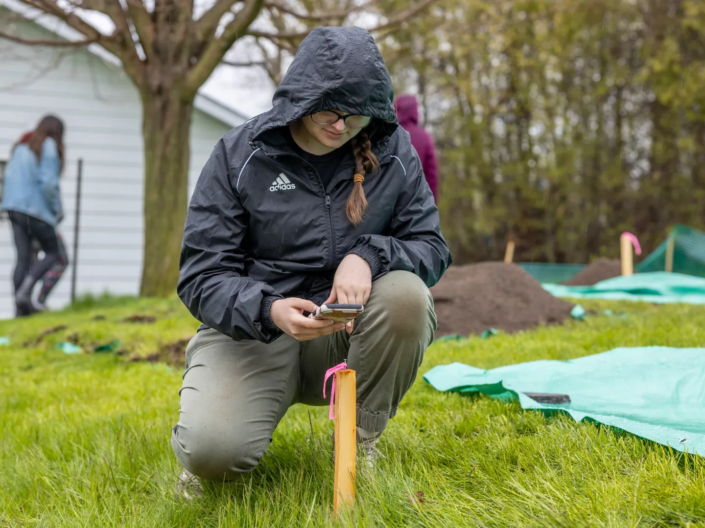 Student doing anthropology field sample. 