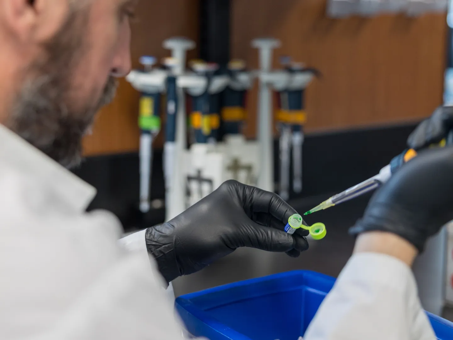 Researcher using pipette.