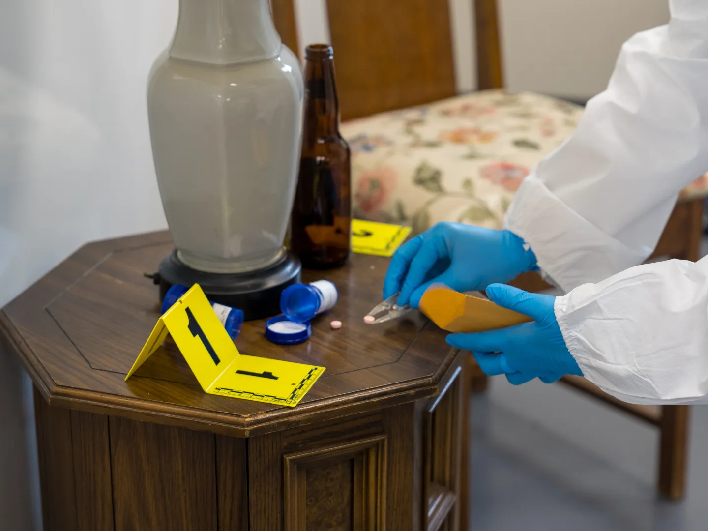 Forensics science crime scene, student picking up evidence.  
