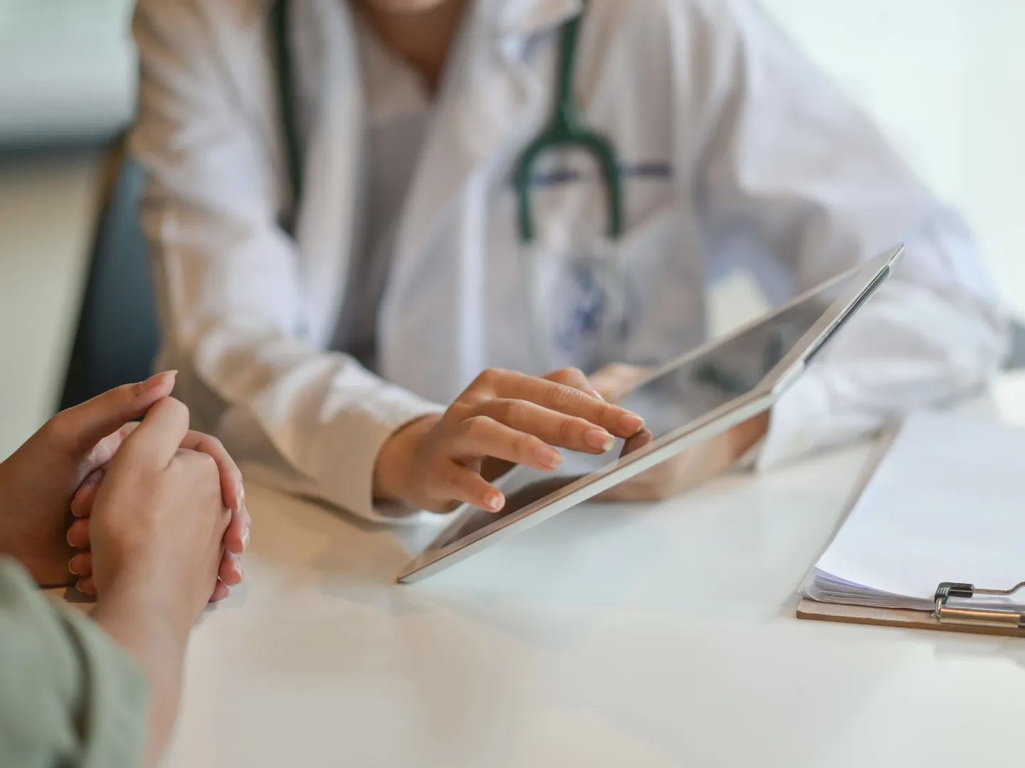 Healthcare worker talking to patient.
