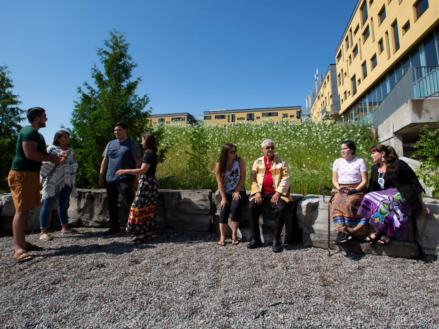 Group talking outside of Gzowski.