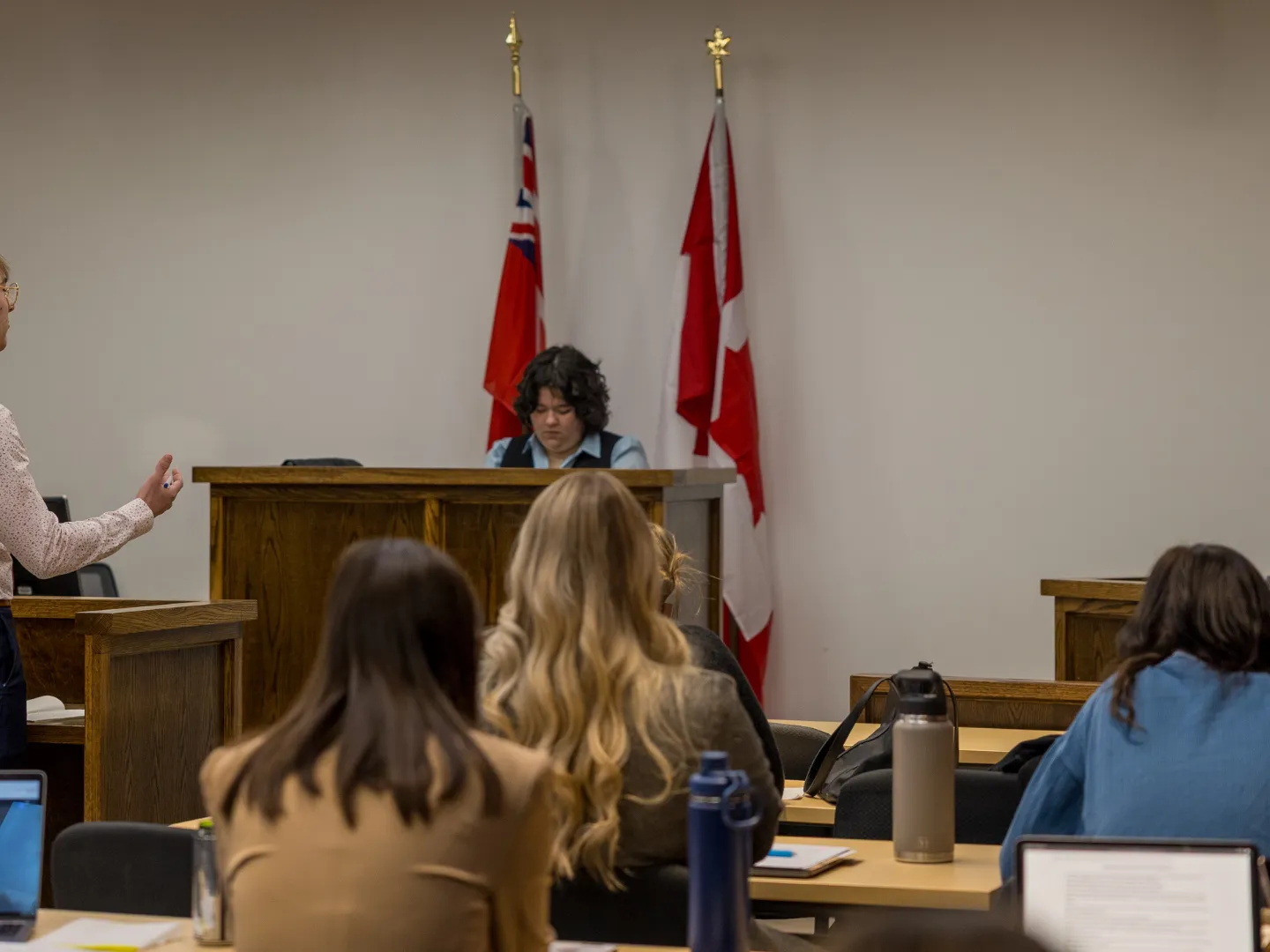 Trent student talking to witness in mock trial.