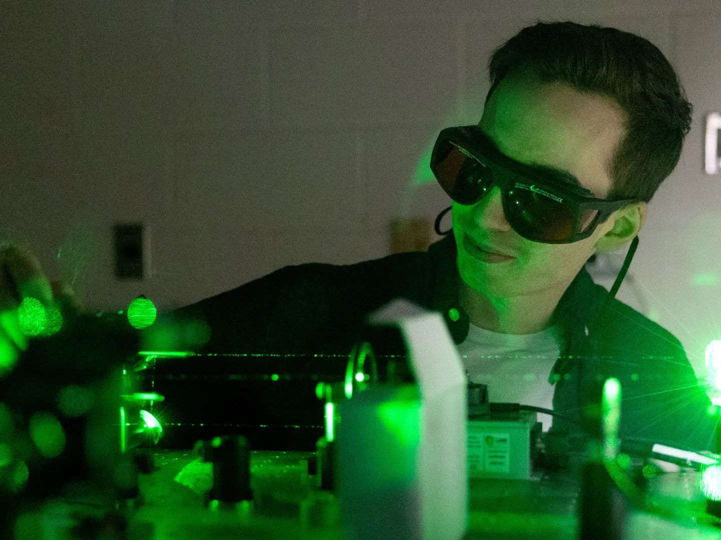 Student working with laser.