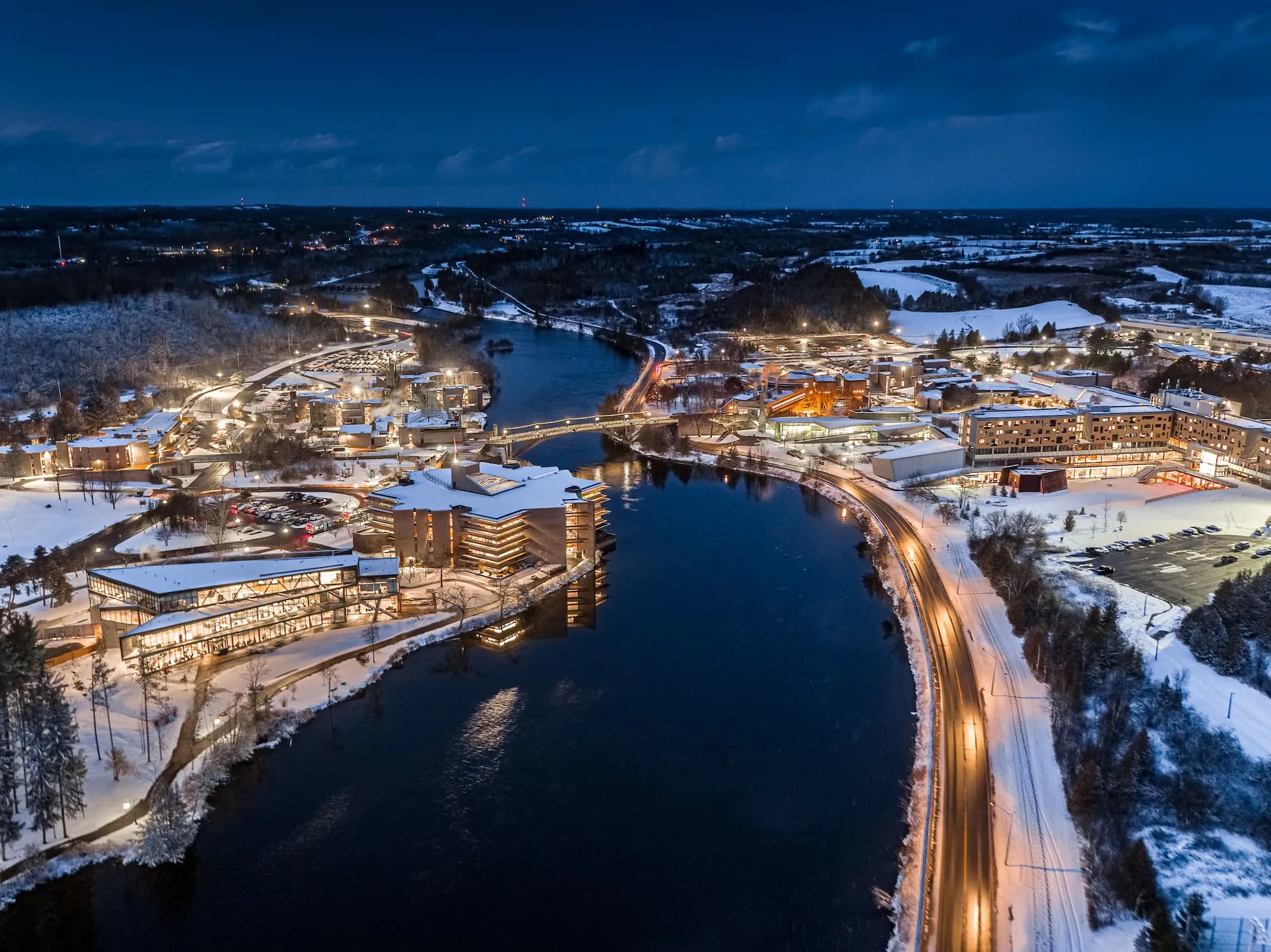 Photo of Trent campus in the winter at night