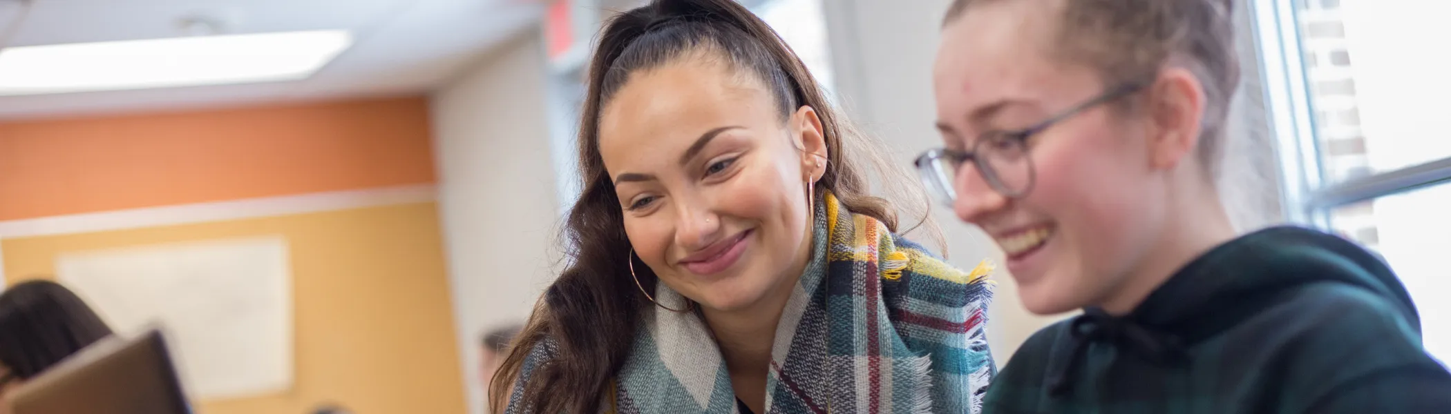 Trent University students working together in class.