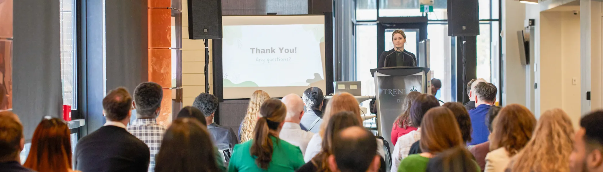 Trent University student giving a presentation to their class.
