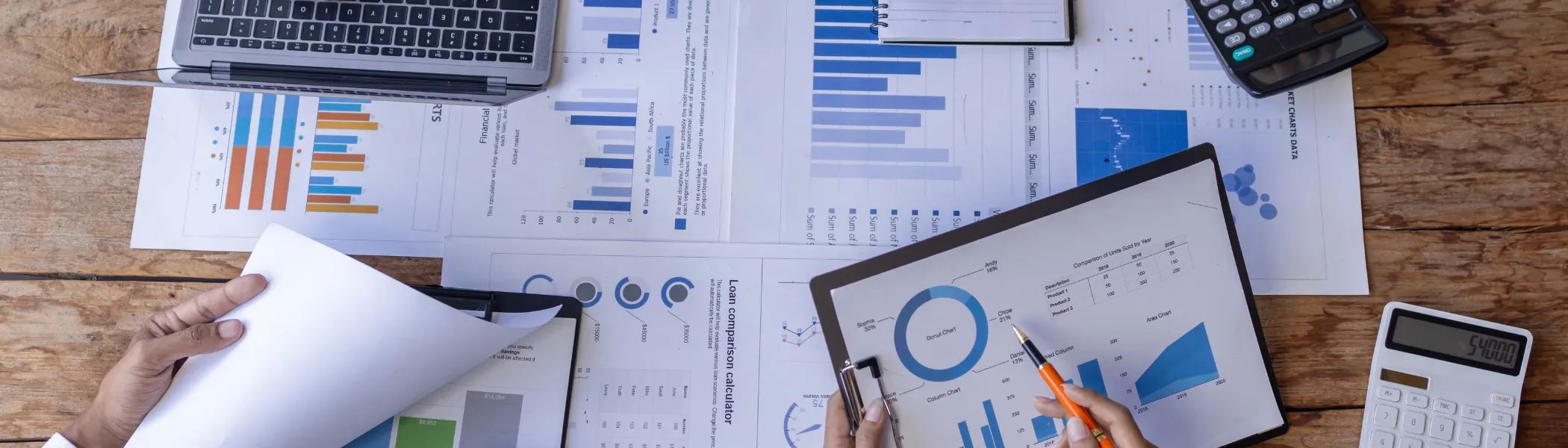 Group working on financial statements and trends. 