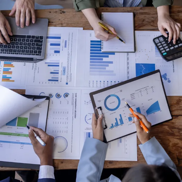 Group working on financial statements and trends. 