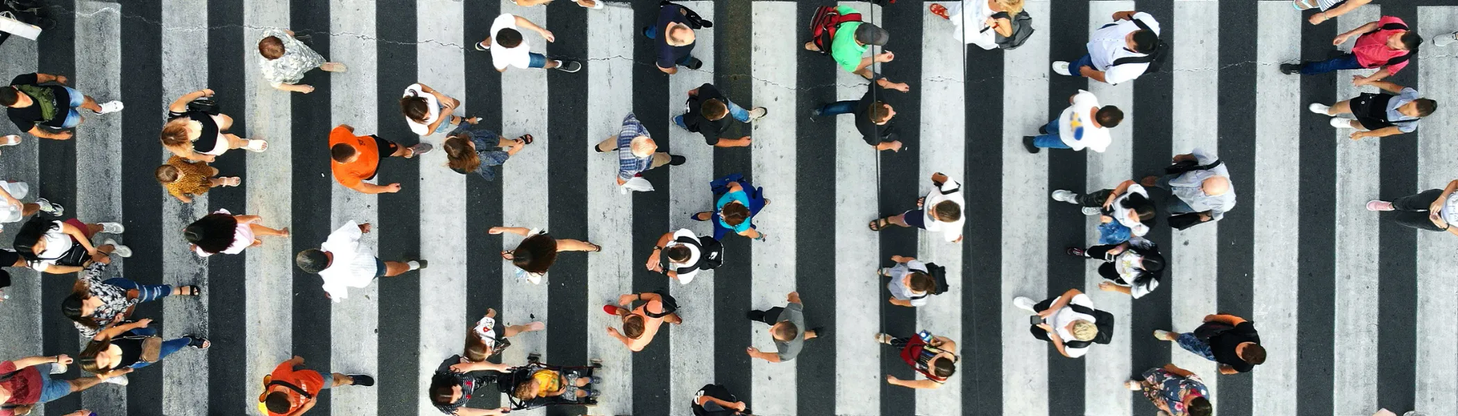 View from above of groups of people walking around a street.