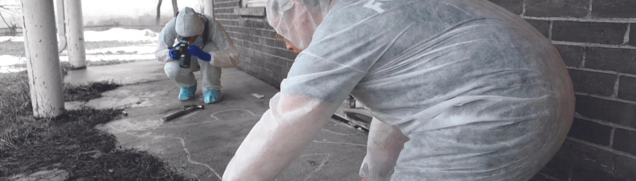 Two students, participating in forensic research lab.