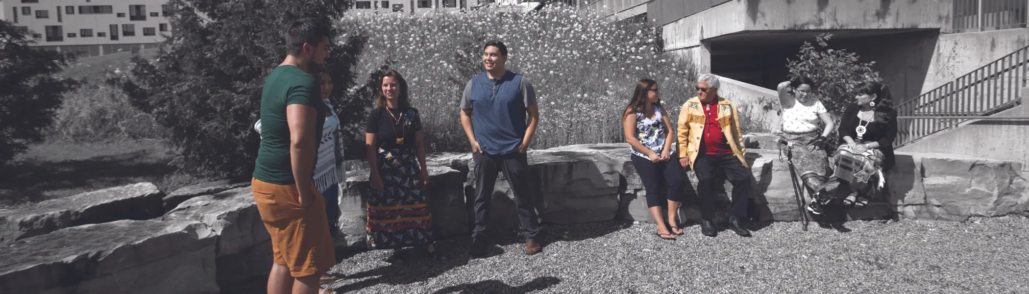 Trent University First Peoples House of Learning students and staff talking outside.