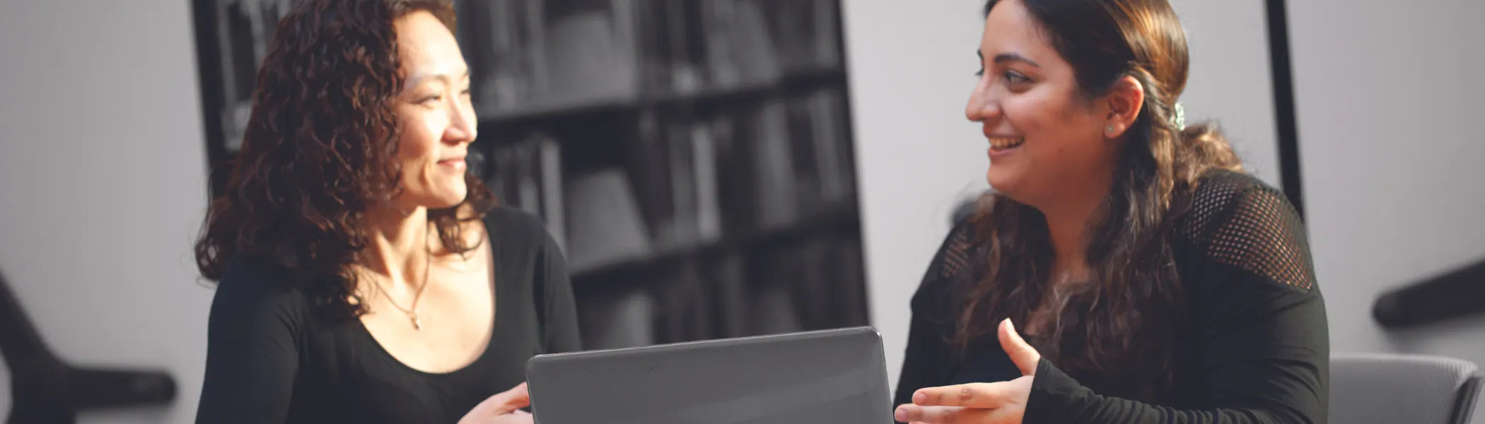 Trent University professor and student talking to each other.