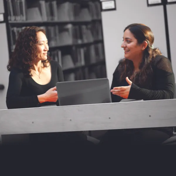 Trent University professor and student talking to each other.