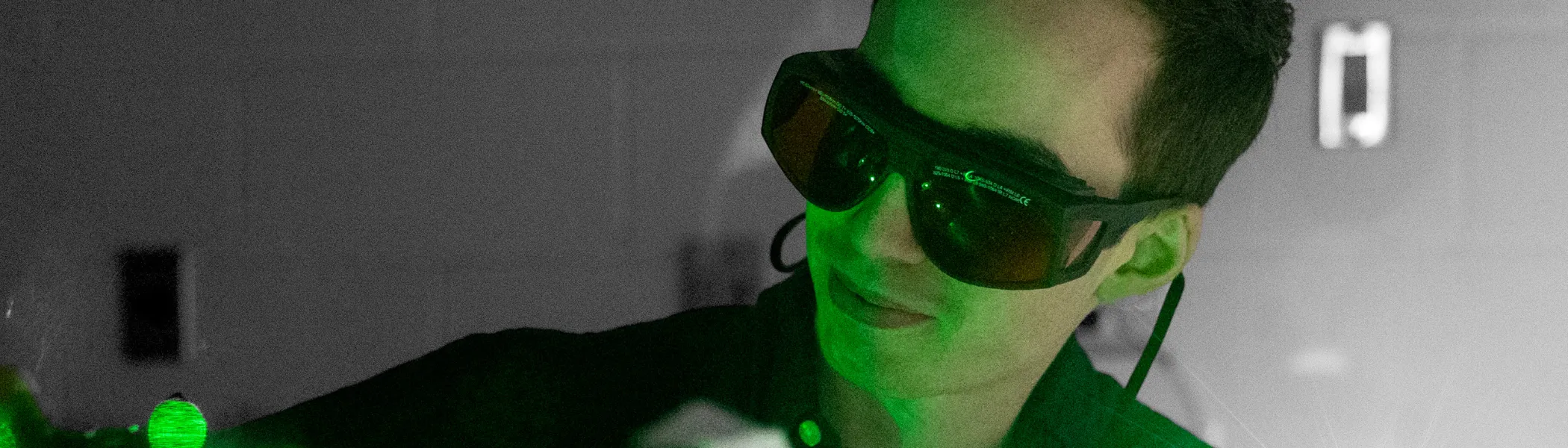 Trent University student using a laser.