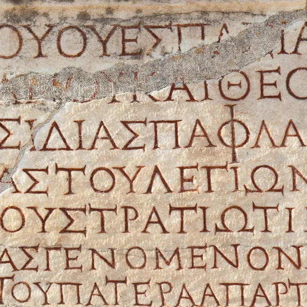 Ancient Greek letters craved stone.