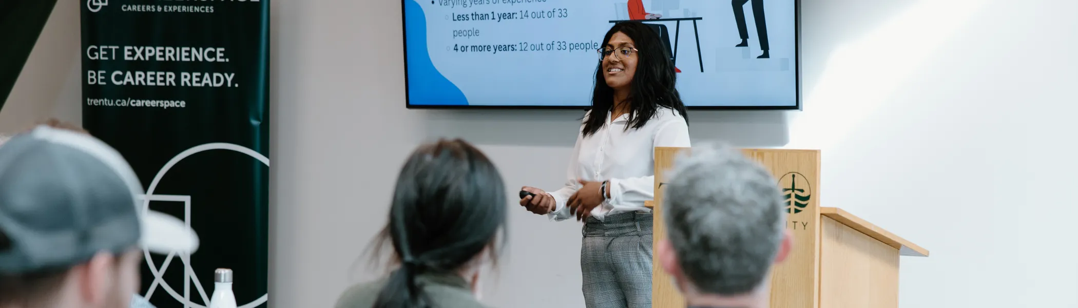 Trent University student giving a presentation to their class.