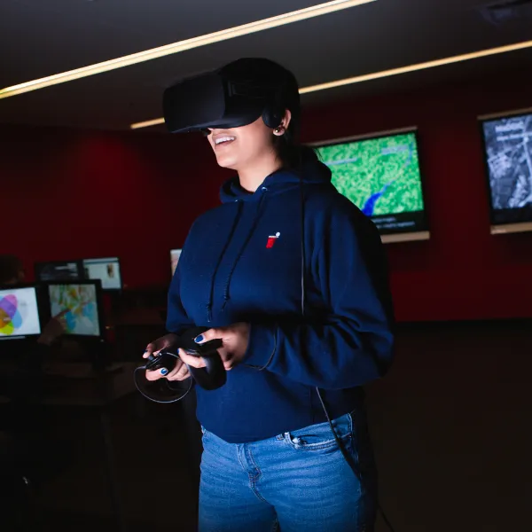 Trent University student using VR headset.