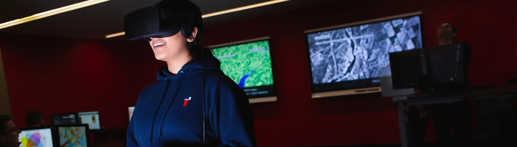 Trent University student using VR headset.