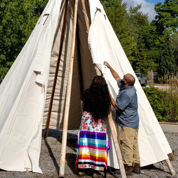 Trent University Durham First Peoples House of Learning students and staff putting up Tipi.