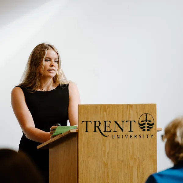 Trent University student giving a presentation to their class.