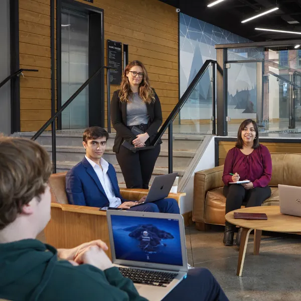 Trent University students in business meeting.